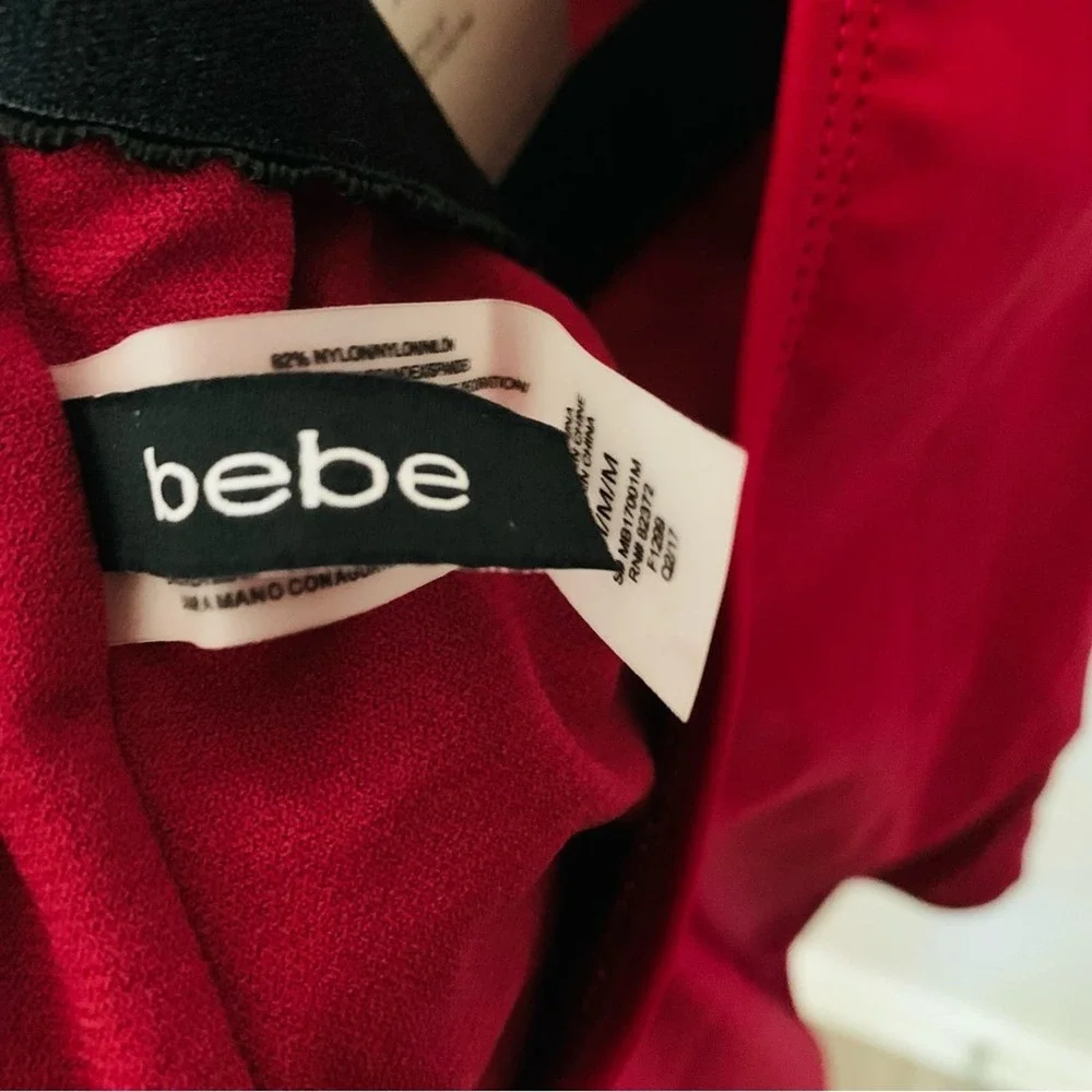 bebe | NWT size medium Burgandy low back one piece swimsuit with rhinestones